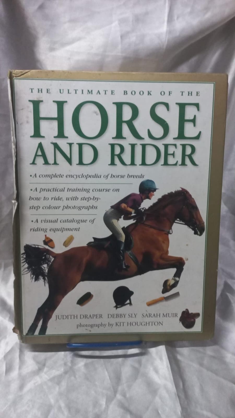 The Ultimate Book of the Horse and Rider: A complete encyclopedia of horse breeds; a practical training course on how to ride, shown in step-by-step photographs; a visual directory of riding equipment Hardcover – September 7, 2014
