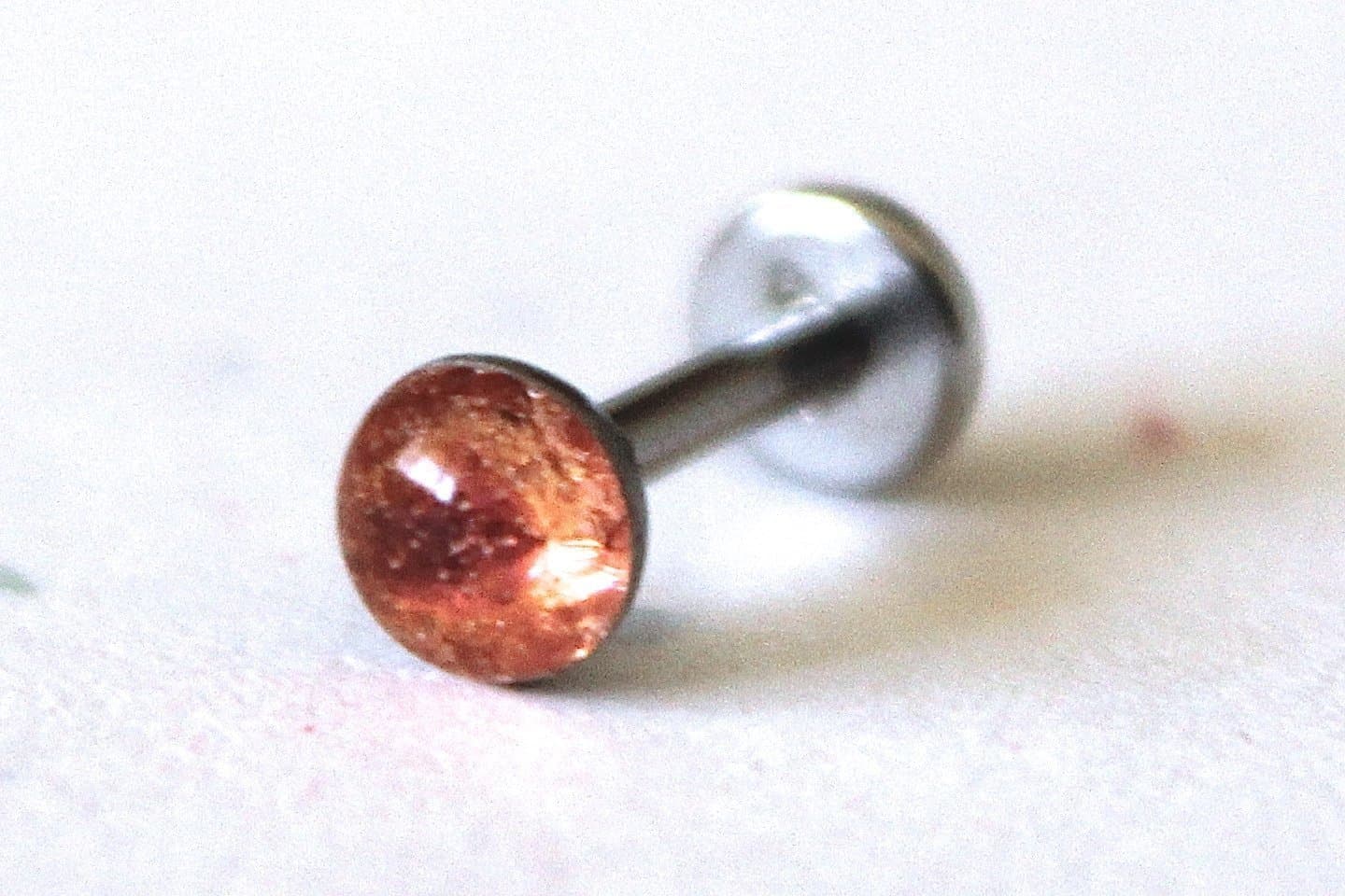 18g or 16g: Light Pink Rust Internally Threaded Labret Stud Earring; 1.5mm, 2mm, 2.5mm, 3mm, 4mm, 5mm Gem Sizes; 5/32" (4mm), 1/4" (6mm), 5/16" (8mm), 3/8" (10mm), 15/32" (12mm) Lengths