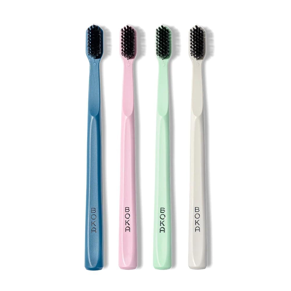Classic Manual Toothbrush with Extra Soft Activated-Charcoal, Tapered Bristles, Bioplastic Handle That Includes Travel Cap, Dentist-Approved, Great for Adults and Kids, Multi Color (Pack of 4)